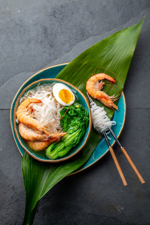 Asian rice noodles with shrimps on gray backgroundの写真素材