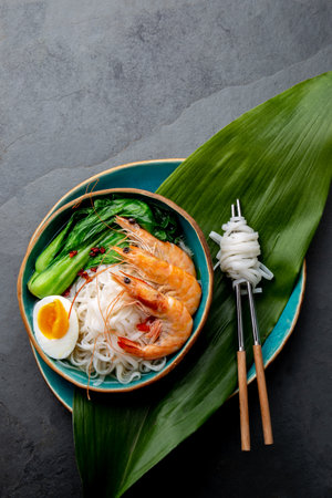 Asian rice noodles with shrimps on gray backgroundの写真素材