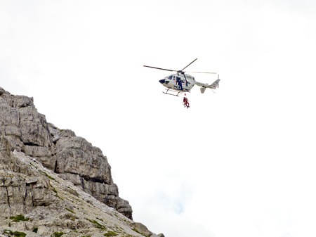 helicopter rescue of a hiker at the Three Peaks of Lavaredo, South Tyrol, Italyのeditorial素材