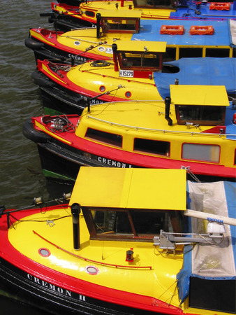 row of round trip boats at the harbour of Hamburg, Germanyの写真素材