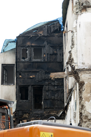 demolition of a burnt-out ruin in the medevial Constance at Lake Constance, Germanyのeditorial素材