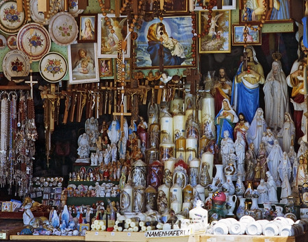 window of a shop with devotional objects at the pilgrimage destination \"Mariazell\", Styria, Austria.のeditorial素材