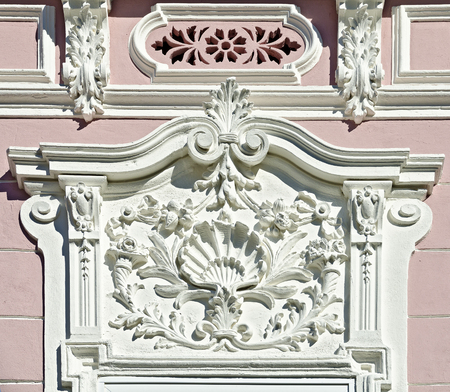 white baroque architectural decoration with ornaments and arabesques on a house front, Weitra, Austriaの写真素材