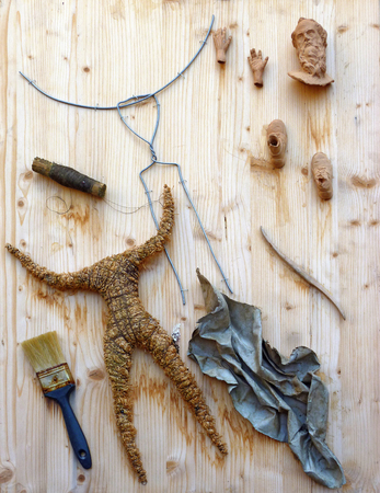 Parts and tools for a traditional Italian handcrafted doll figureの写真素材