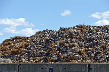 heap of metallic waste before blue sky at the harbour of Hamburg, Germanyの写真素材