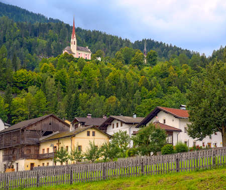 Lavant, a country village near Lienz in Eastern Tirol with the church St. Ulrich on the hill...