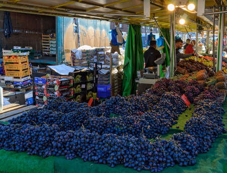 Fruit stall with blue grapes on a market in Hamburg, Germany