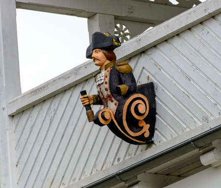 figure in uniform of a captain as house mark in the spa village Binz on he Baltic sea, Germany