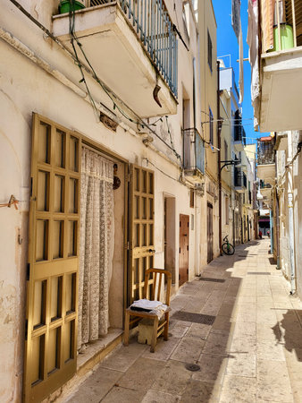 Narrow cobblestone street in Southern Italy. Puglia. Italy.の写真素材