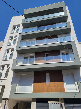 Modern apartment buildings on a sunny day with a blue sky. Facade of a modern apartment buildingの写真素材