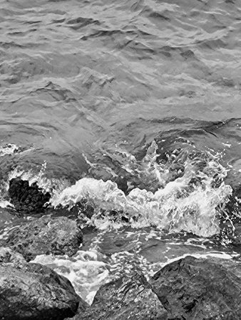 Black and white photo of ocean waves crashing on coastal rocks in Puglia, Southern Italy â dramatic Mediterranean seascape with rocky shoreline. sea waves.の写真素材