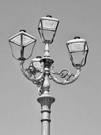 old street lamp on blue sky background, black and white photo.の写真素材