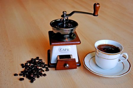 Grinder, cup and coffee grainの写真素材