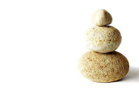 Pyramid of three stones over whiteの写真素材