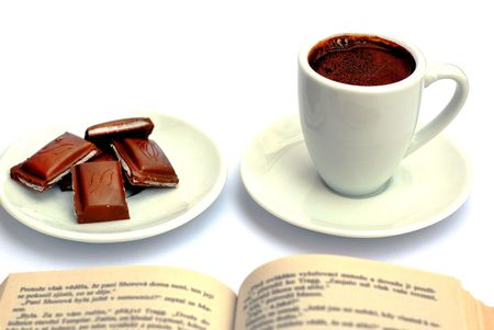 Cup of coffee, chocolate and bookの写真素材