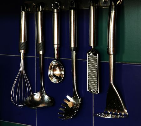 Kitchen ladles hanging on the wall in the kitchen