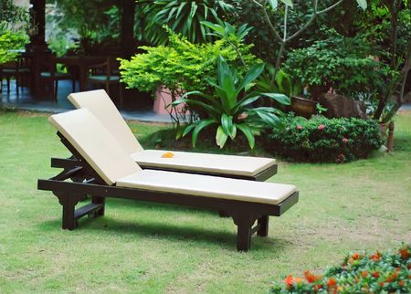 Two sun beds in the garden .の写真素材