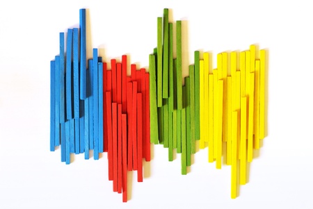 The blue, red, green and yellow wooden sticksの写真素材