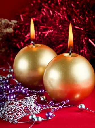 Two golden candles - christmas still life .の写真素材
