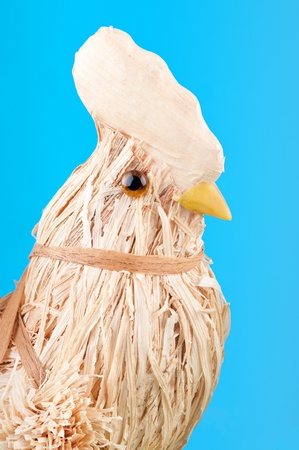 The straw cock on the blue background .の写真素材