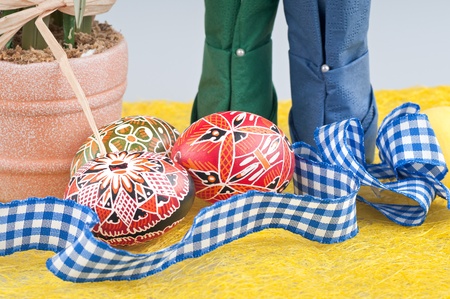 Easter still life - pot, painted eggs, ribbon 