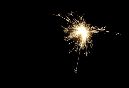 The sparks from the sparkler on black background