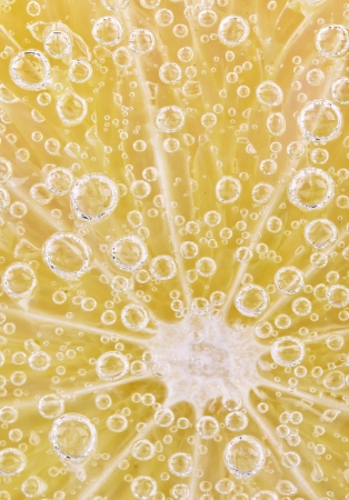 Closeup of lime slice with soda in glass の写真素材