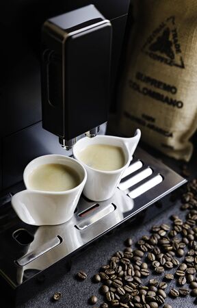 Automatic coffee maker and two cupsの写真素材