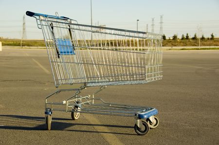 Shopping Cart sitting alone in a parking lotの写真素材