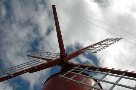 Old windmill in the Azores against the sky 