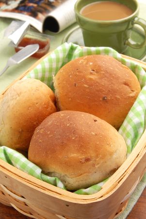 Basket full of fresh baked dinner rolls. の写真素材