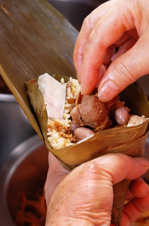 Makes the steamed rice dumpling の写真素材