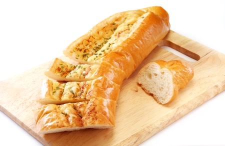 Garlic bread on wooden boardの写真素材