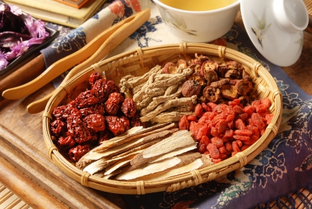 Different kind of Chinese herbal medicine on wicker baskets Different kind of Chinese herbal medicine on wicker baskets