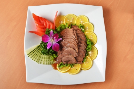 Sliced braised beef shank  on white plate  の写真素材