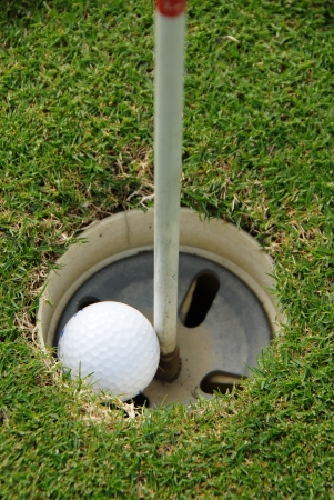 Golf ball hole in oneの写真素材