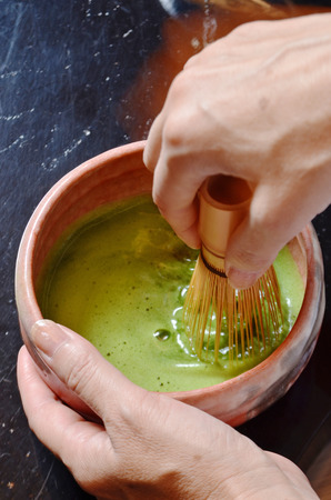 Japanese tea ceremony,Matcha tea prepared with bamboo whiskの写真素材