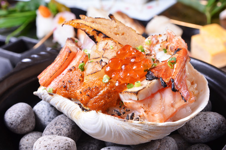 Seafood with rice on the half shellの写真素材