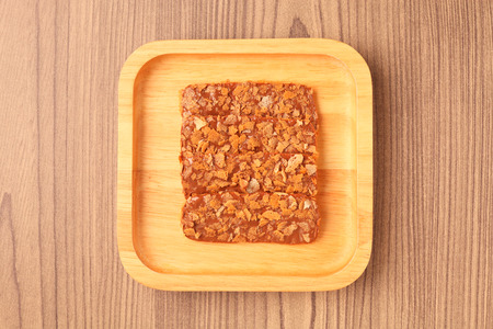 Chocolate crunch on wooden plateの写真素材