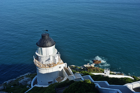 White lighthouse with a blue skyの写真素材
