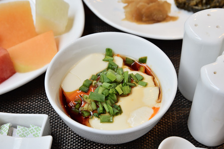 Tofu with soya sauce on white bowlの写真素材