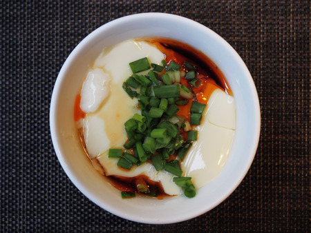 Tofu with soya sauce on white bowlの写真素材