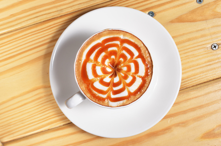 Hot caramel macchiato on the tableの写真素材