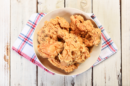 Crispy fried chicken on wooden tableの写真素材