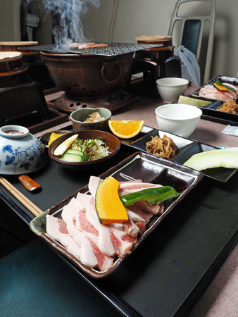 Grilled pork meat and vegetable with soup on table, Japanese foodの写真素材