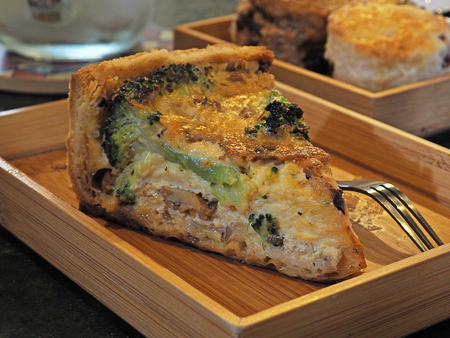 Quiche lorraine slice on a wooden trayの写真素材
