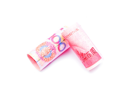 Rolls of one hundred New Taiwan Dollar bill and chinese yuan banknotes isolated on white backgroundの写真素材