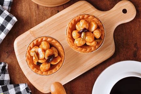 Macadamia nuts tart on wooden tableの写真素材