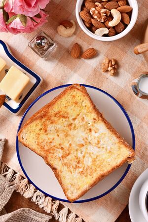 Golden brown french toasts on white plate.の写真素材