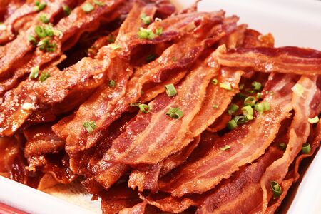 Crispy hot fried bacon in buffet corner, close upの写真素材